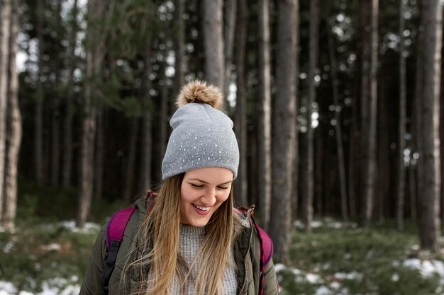 Medium shot smiley woman with hat