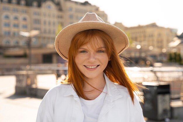 Medium shot smiley woman with hat