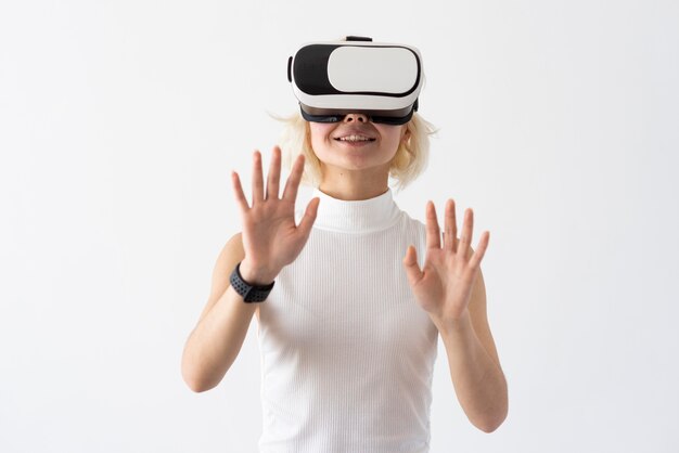 Medium shot smiley woman with vr glasses