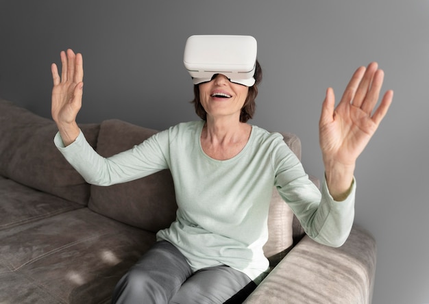 Medium shot smiley woman with vr glasses