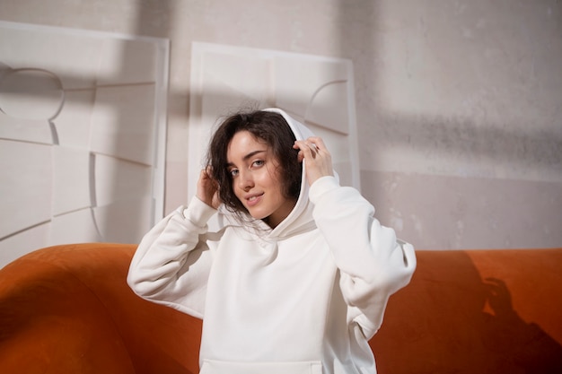 Medium shot smiley woman with white hoodie