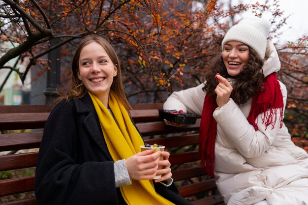 medium shot smiley women outdoors