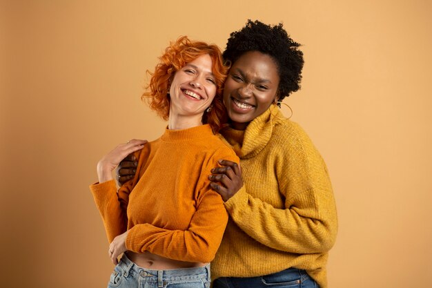 Medium shot smiley women posing together