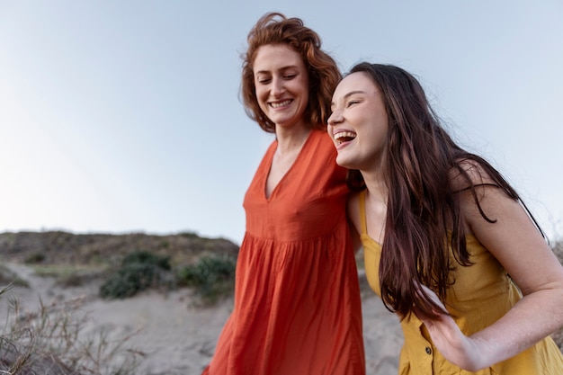 Medium shot smiley women posing together