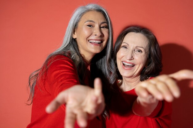 Medium shot smiley women at studio