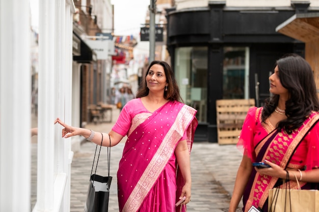 Medium shot smiley women walking together