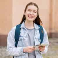 Free photo medium shot of smiley young traveller