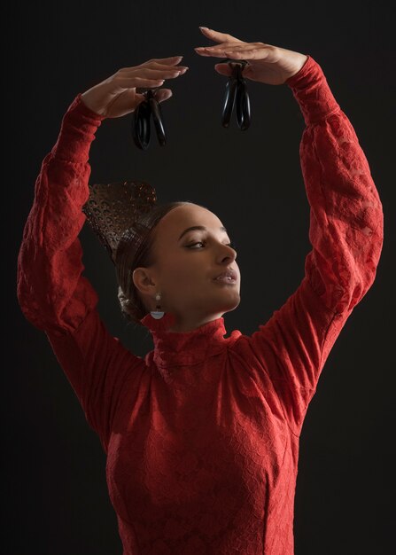 Medium shot spanish woman posing in studio