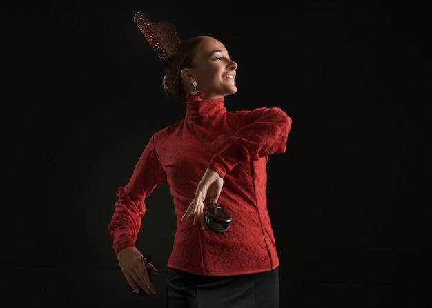 Medium shot spanish woman posing in studio