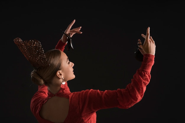 Medium shot spanish woman posing in studio