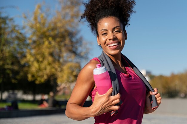 Medium shot sporty woman outdoors