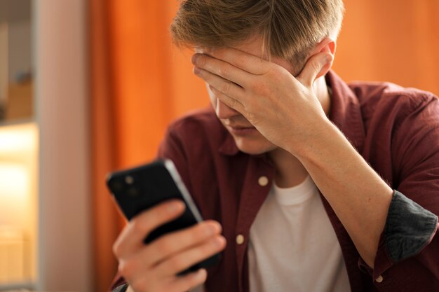 Medium shot suffering teenager being cyberbullied