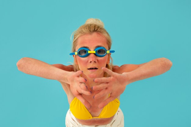 Medium shot sunburned woman posing in studio