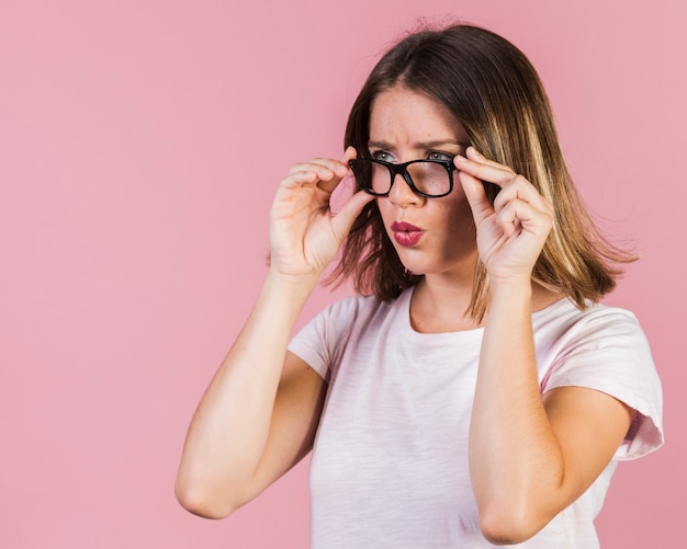 Medium shot surprised girl with glasses