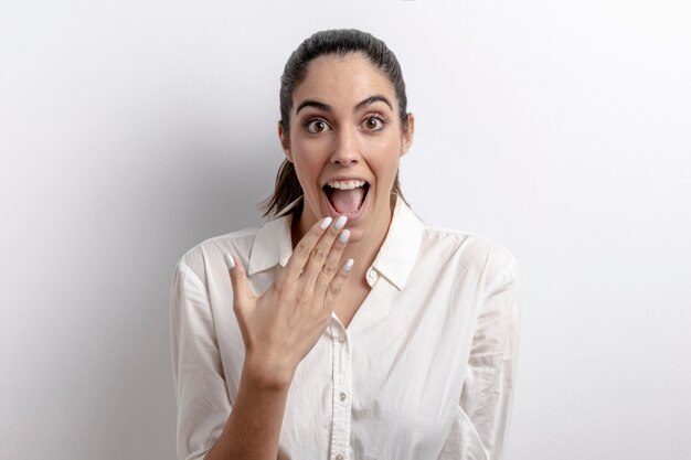 Medium shot surprised woman with white background