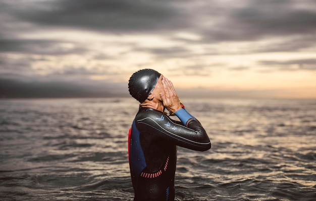 Free photo medium shot swimmer at seaside