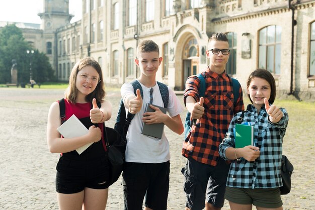 Medium shot of teenage friends approving