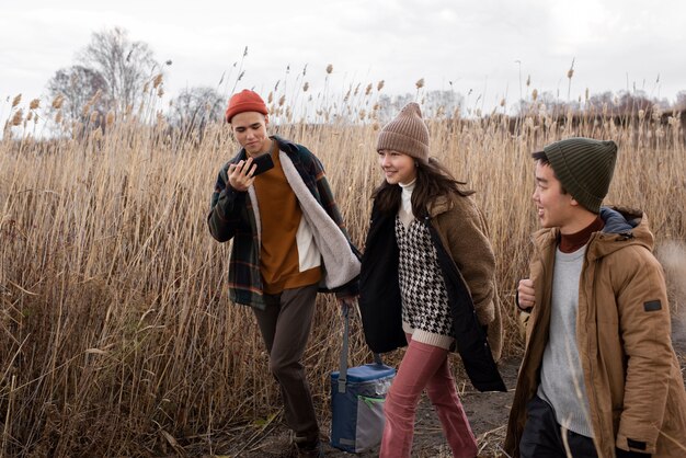 Medium shot teens walking together