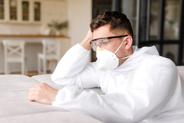 Medium shot tired man wearing mask