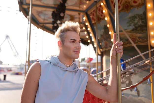 Medium shot transgender at amusement park