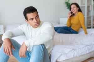 Free photo medium shot of upset man in bedroom