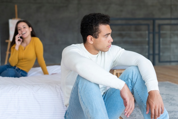 Free photo medium shot of upset man looking away