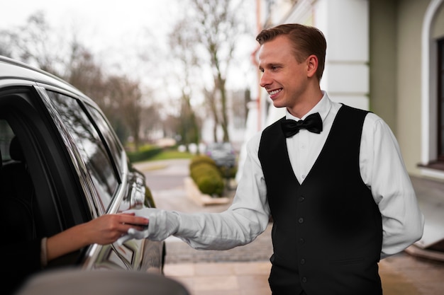 Medium shot valet parking car