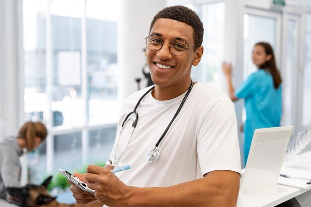 Medium shot veterinarian with stethoscope