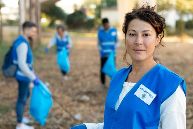 Medium shot volunteers with equipment