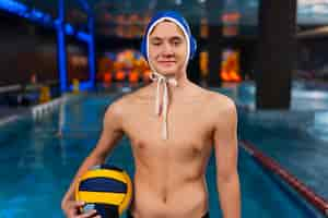 Free photo medium shot waterpolo  player with equipment