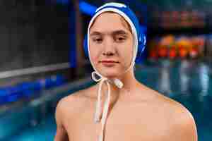 Free photo medium shot waterpolo  player with equipment