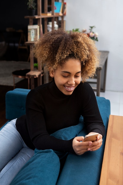 Free photo medium shot woman addicted to smartphone