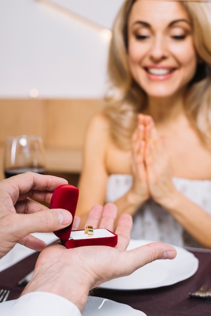 Medium shot of woman being proposed to