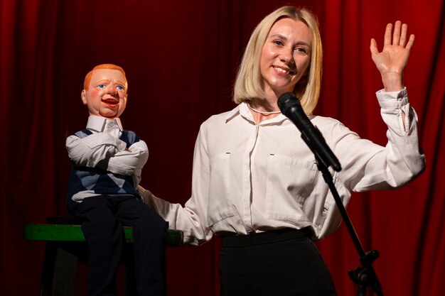 Medium shot woman being ventriloquist