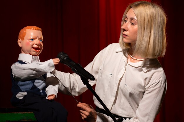 Medium shot woman being ventriloquist