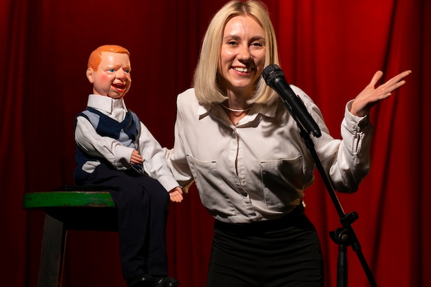 Medium shot woman being ventriloquist