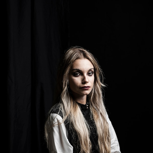 Medium shot of woman on black background