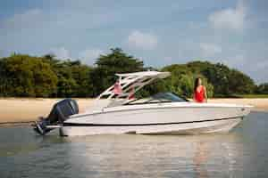 Free photo medium shot woman on boat