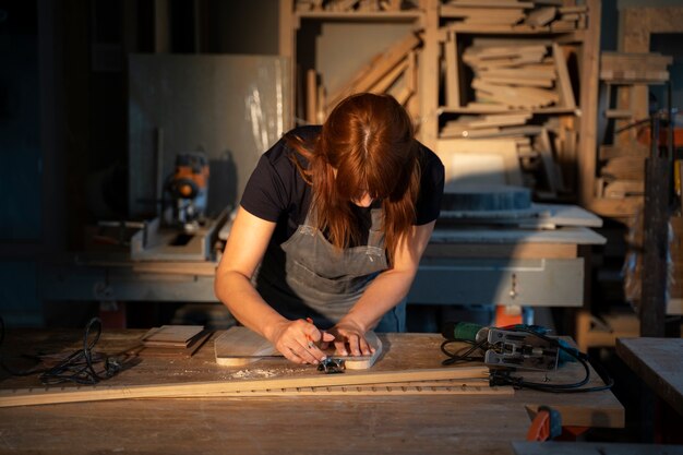 Medium shot woman carpenter with apron