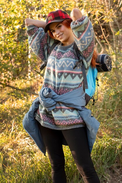 Medium shot woman carrying backpack