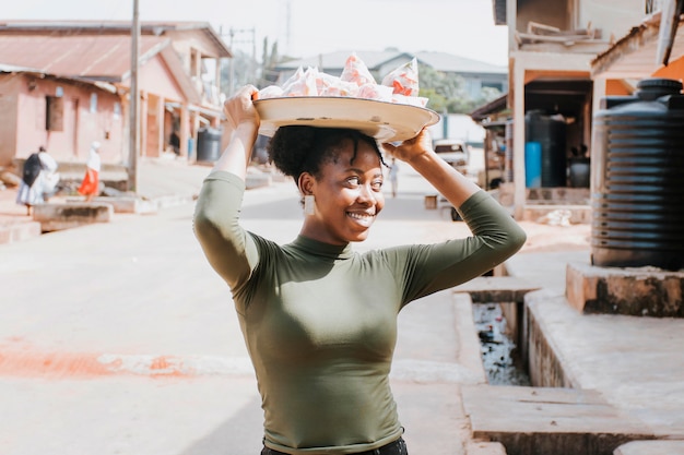 Medium shot woman carrying food