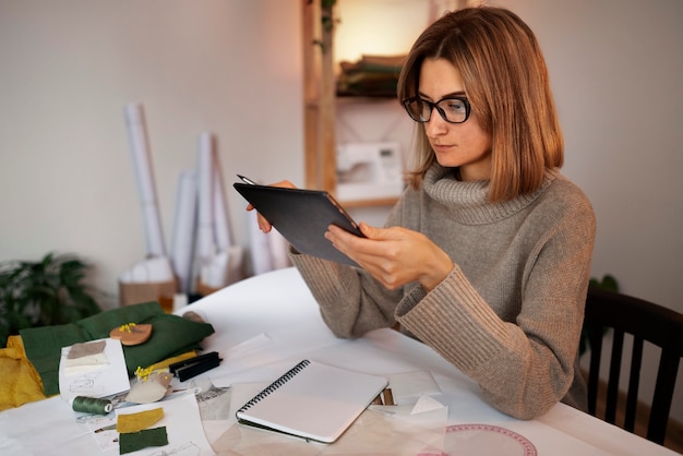 Free photo medium shot woman creating vision board