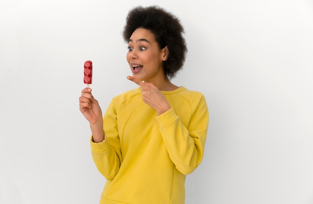 Free photo medium shot woman eating ice cream