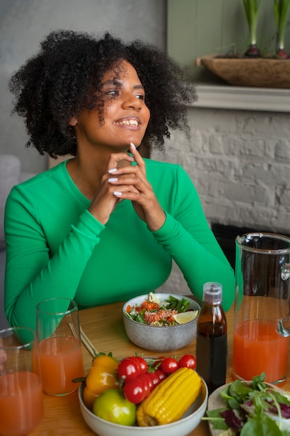 Medium shot woman eating salmon bowl