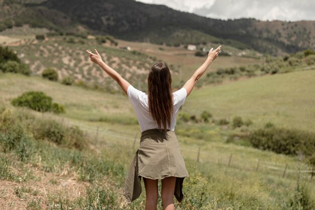 Medium shot woman expressing freedom