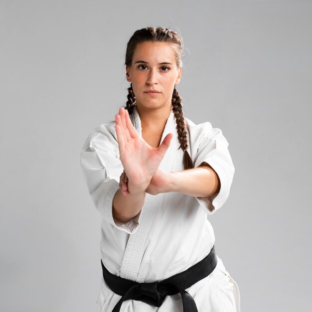 Medium shot of woman fighter front view