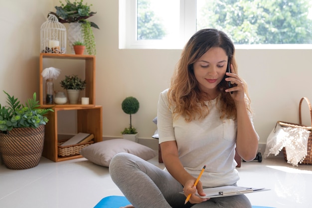 Medium shot woman on floor working