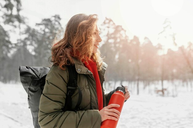 Medium shot woman forest hiking