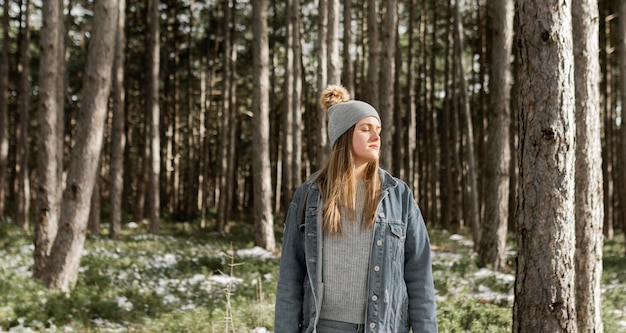 Medium shot woman in forest