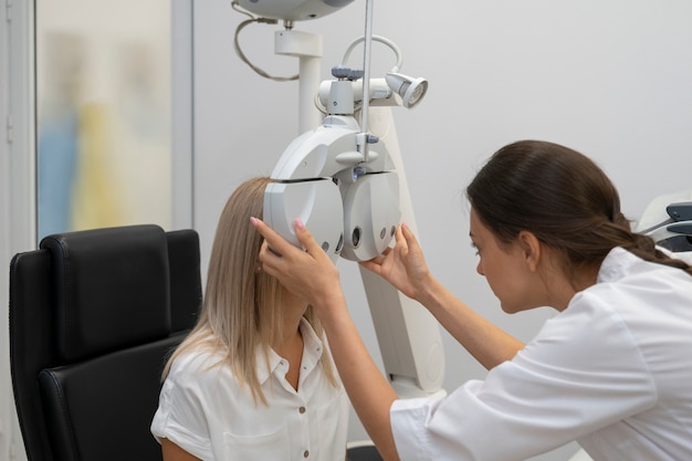 Medium shot woman getting her eyes checked